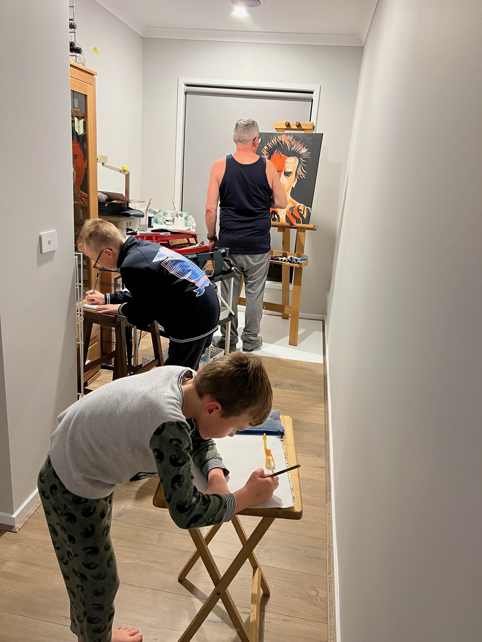 David Lacy painting with family